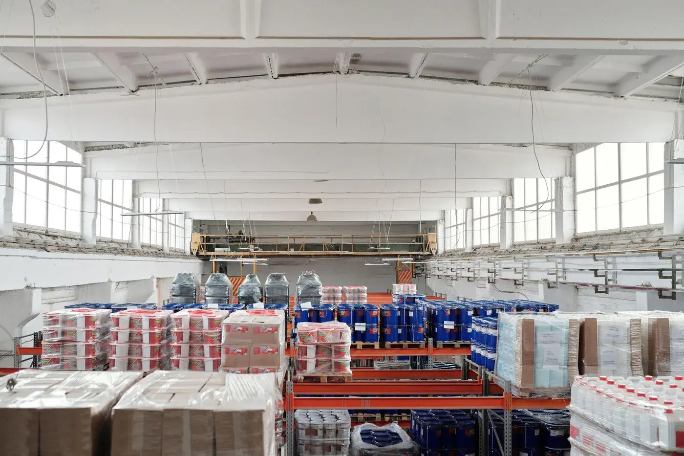 Warehouse worker preparing boxed goods for outbound shipment